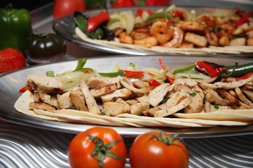 Chicken fajitas with onions and bell peppers